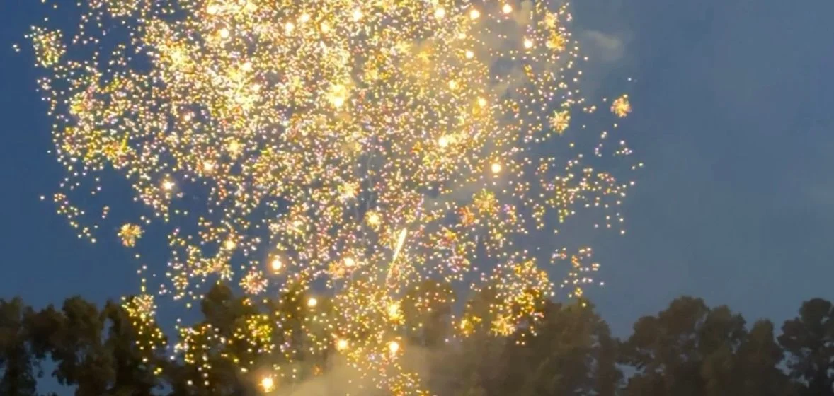 Fireworks bursting over Lake Georgia on a holiday weekend
