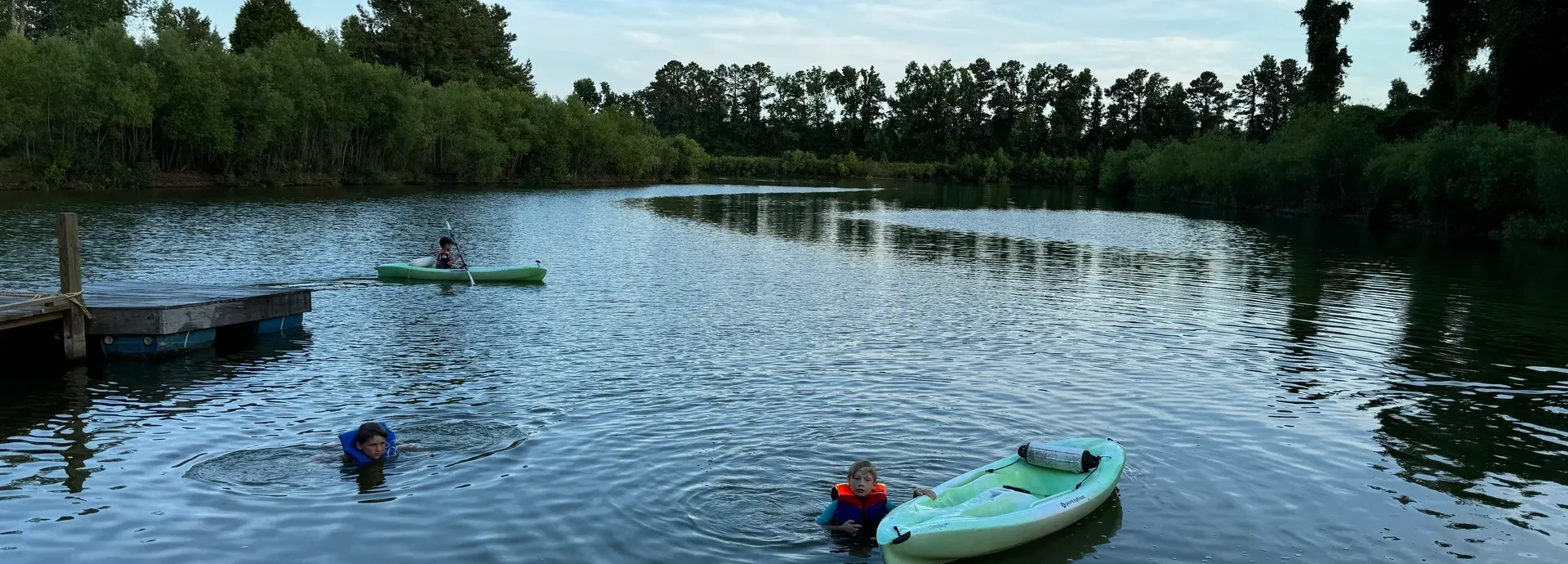 Kids swimming and kayaking on Lake Georgia